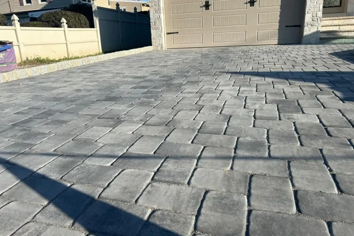 Completed driveway with interlocking bricks in herringbone pattern