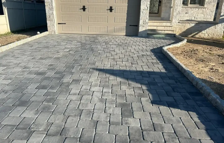 Completed driveway with interlocking bricks in herringbone pattern