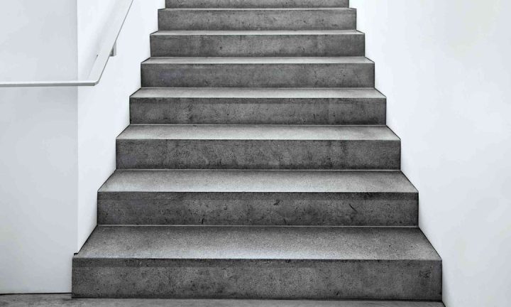 Concrete staircase leading upwards with no handrails