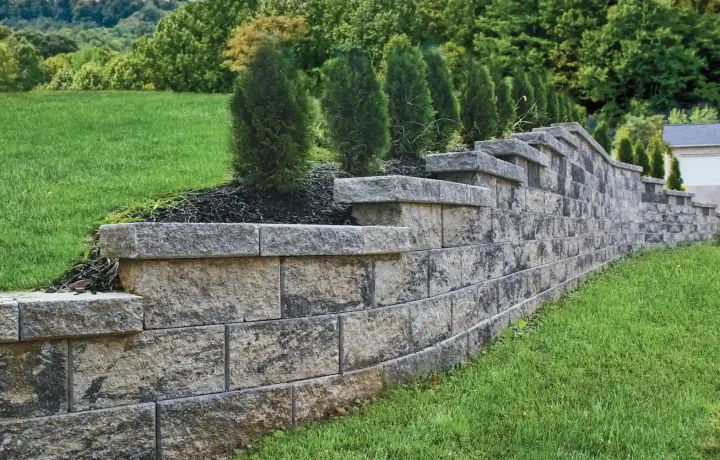 Interlocking block retaining wall with natural stone appearance