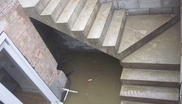 Top-down view of staircase foundation with water pooled at the base