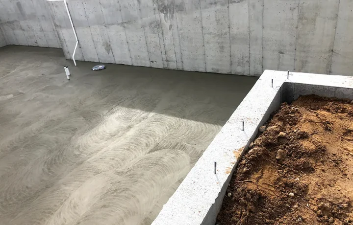 Stem wall foundation with concrete walls extending above ground level